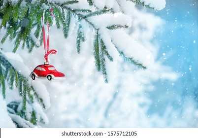 Christmas background. decorative glass toy Christmas car on snowy fir tree outdoor. symbol of winter festive season. template for design. copy space - Powered by Shutterstock