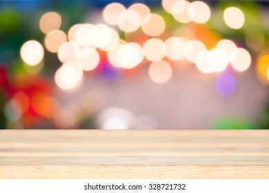 Christmas Background With Empty Wood Table Over Christmas Bokeh For Product Montage.