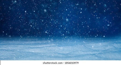 Christmas background with falling snow, selective focus. Beautiful Winter night landscape. Nature Winter background with Copy Space for design. - Shutterstock ID 1856010979