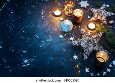 Christmas background with festive decoration, stars and candles. Christmas background with copyspace