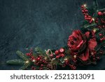 Christmas background with festive seasonal decor. Garland of fir branches and decorated with lights, flowers and berries