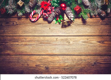 Christmas background with fir tree and decoration on dark wooden board - Powered by Shutterstock