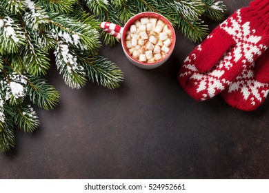 Christmas background with fir tree and hot chocolate with marshmallow. Top view with copy space - Powered by Shutterstock