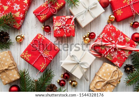 Christmas background with gift boxes and decorations on white wooden table