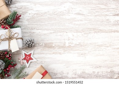 Christmas background with handmade gift boxes and decorations on white wooden board. Creative Flat layout and top view composition with border and copy space design - Powered by Shutterstock