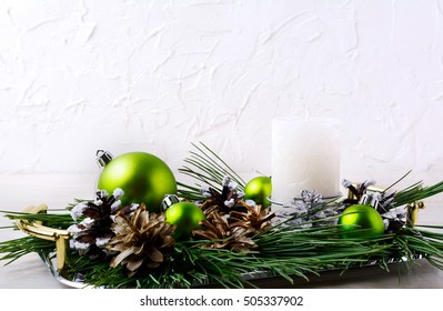 Christmas Background With Holiday Ornaments And Candle Centerpiece. Christmas Greeting Card With Pine Cones. Copy Space.