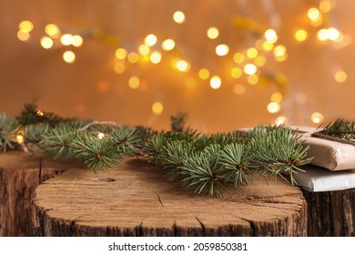 Christmas background with natural wood scene and defocus lights. Rustic composition with fir branches, gifts, mockup for products and goods. - Shutterstock ID 2059850381