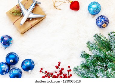 Christmas Background On The Theme Of Travel. The Plane Symbolizes The Gift Of The Journey. Selective Focus. Holiday