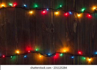 Christmas Background. Planked Wood With Lights And Free Text Space