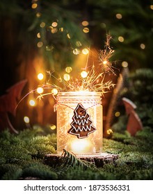 Christmas Background With Sparkler In Glass Jar