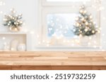 Christmas background table with copy space on blur decorated frosty window interior