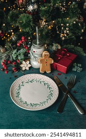 Christmas background with table setting and festive decor, milk drink, Santa's cookies and gifts