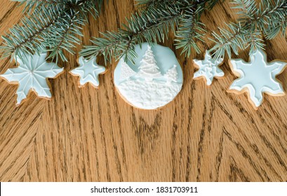 Christmas background. Christmas tree, gingerbread decorate light blue icing on a wooden table - Shutterstock ID 1831703911
