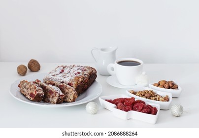 Christmas Baked Goods With Cup Of Coffee On White Table