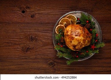 Christmas Baked Ham, Served On The Old Plate. Spruce Twigs All Around. Top View.