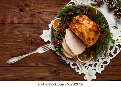 Christmas Baked Ham, Served On The Old Plate. Spruce Twigs All Around. Top View.