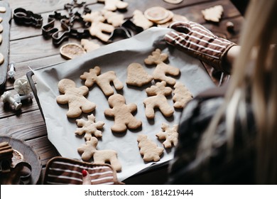 Christmas bakery. Festive food, cooking process, family culinary, Christmas and New Year traditions concept. Woman hands holding homemade gingerbread cookies