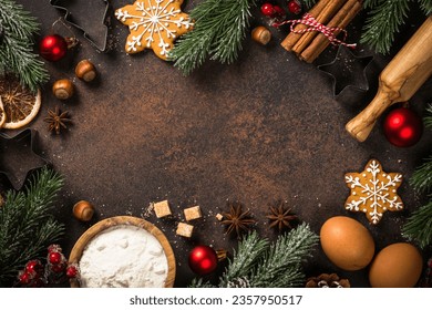 Christmas baking background at dark table.