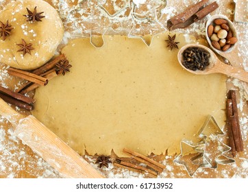 Christmas baking background: dough, cookie cutters, spices and nuts. Viewed from above. - Powered by Shutterstock