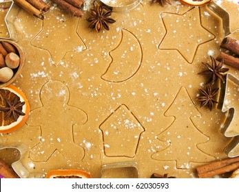 Christmas baking background: dough, cookie cutters, spices and nuts. Viewed from above. - Powered by Shutterstock