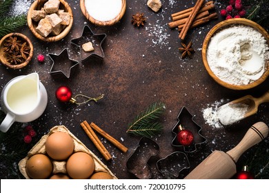 Christmas Baking Background. Ingredients For Cooking Christmas Baking On Dark Stone Background. Top View With Copy Space.