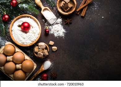 Christmas Baking Background. Ingredients For Cooking Christmas Baking On Dark Rusty Background. Top View With Copy Space.