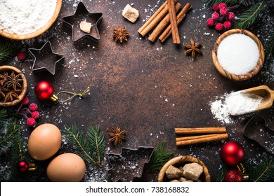 Christmas Baking background. Ingredients for cooking christmas baking on dark stone background. Top view with copy space.