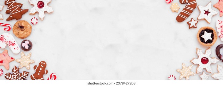 Christmas baking double border with assorted cookies and sweet treats. Top view on a white marble banner background with copy space. Holiday baking concept. - Powered by Shutterstock