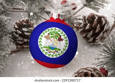 Christmas ball with the flag of Belize, decorates the snow tree with snowfall. The concept of the Christmas and New Year holiday - Powered by Shutterstock