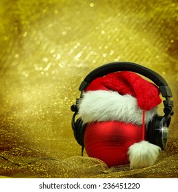 Christmas Ball With Headphones In Glittering Background