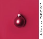 Christmas ball on Proton Purple. New Year greeting card with place for text. New 2023 trending PANTONE 18-1750 Viva Magenta color