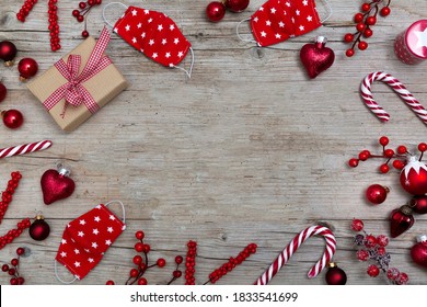 Christmas balls, Christmas face masks on wooden background, top view - Powered by Shutterstock