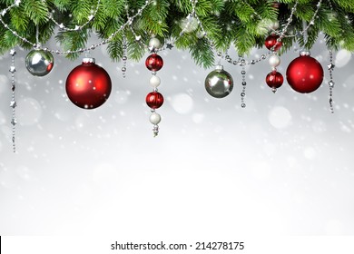 Christmas Balls Hanging On Snowy Fir Tree