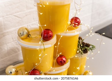 Christmas balls and jars of honey, New Year's spruce, golden balls