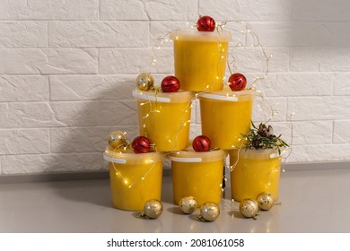 Christmas balls and jars of honey, New Year's spruce, golden balls
