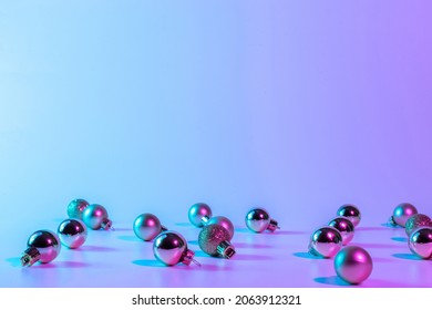 Christmas balls neon winter background. Xmas bauble on abstract holiday gradient backdrop. Happy new year copy space - Powered by Shutterstock