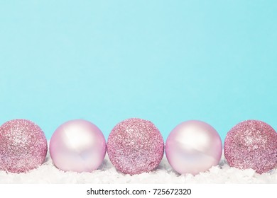 Christmas balls on white and blue background