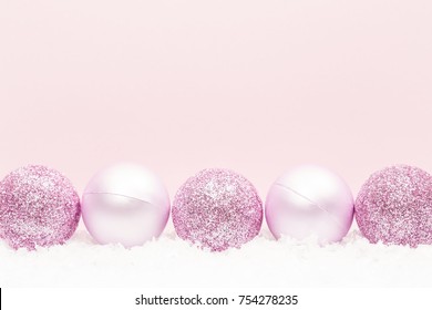 Christmas balls on white snow