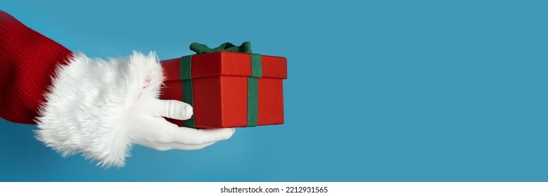 Christmas Banner, Santa's Hand Holding A Gift Box, Christmas Card