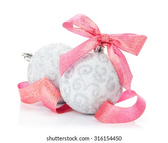 Christmas baubles and red ribbon. Isolated on white background
