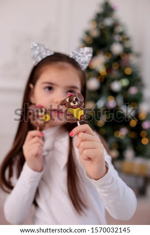 Christmas beauty smiling girl with long blond hair in a good mood