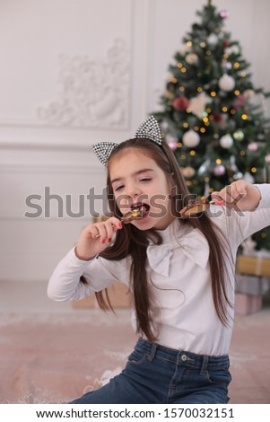 Christmas beauty smiling girl with long blond hair in a good mood