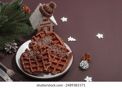 Christmas Belgian waffles with chocolate. Festive New Year dessert, traditional arrangement. Lactose free non gluten baking, trendy hard light, dark shadow, copy space - Powered by Shutterstock