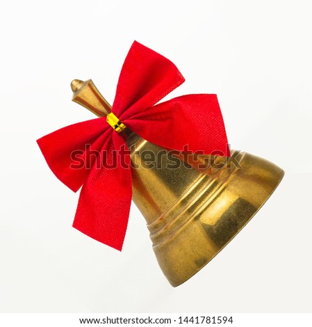Christmas bells with red bows isolated on white background