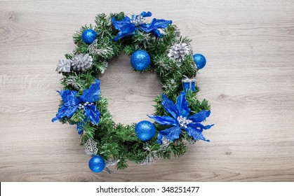 Christmas Blue Wreath On Wood.
