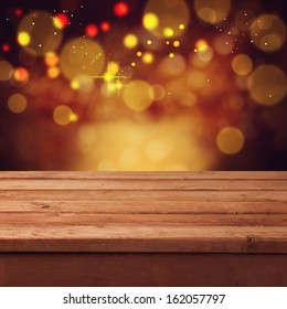 Christmas Bokeh Background With Empty Wooden Table. Perfect For Product Display Montage