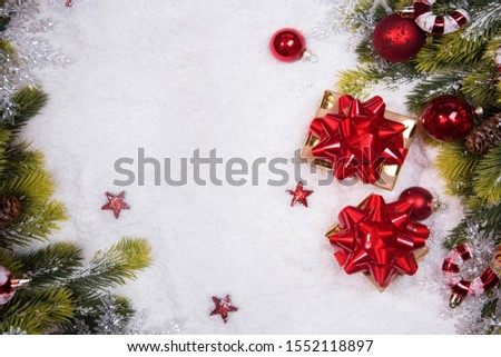 Christmas border flat lay with pine, presents and snow. Cristmas and New Year holiday background.