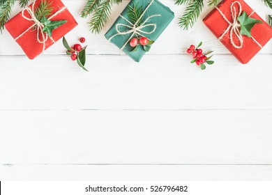 Christmas Border. Christmas Gifts, Fir Branches On Wooden White Background. Flat Lay, Top View, Copy Space