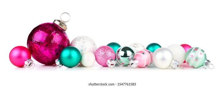 Christmas Border Of Pink, Teal And White Ornaments. Side View Isolated On A White Background.
