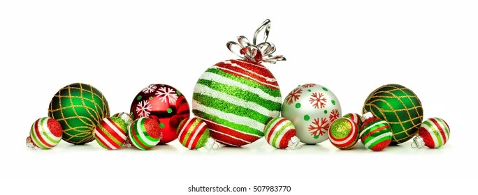 Christmas Border Of Red, Green And White Ornaments Isolated On A White Background